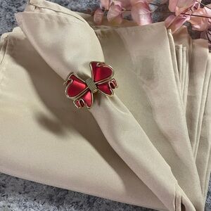 Elegant Red and Gold Bow Napkin Ring set 12

EUC
Used one time 
Very pretty